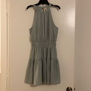 Short summer dress with opening on back.